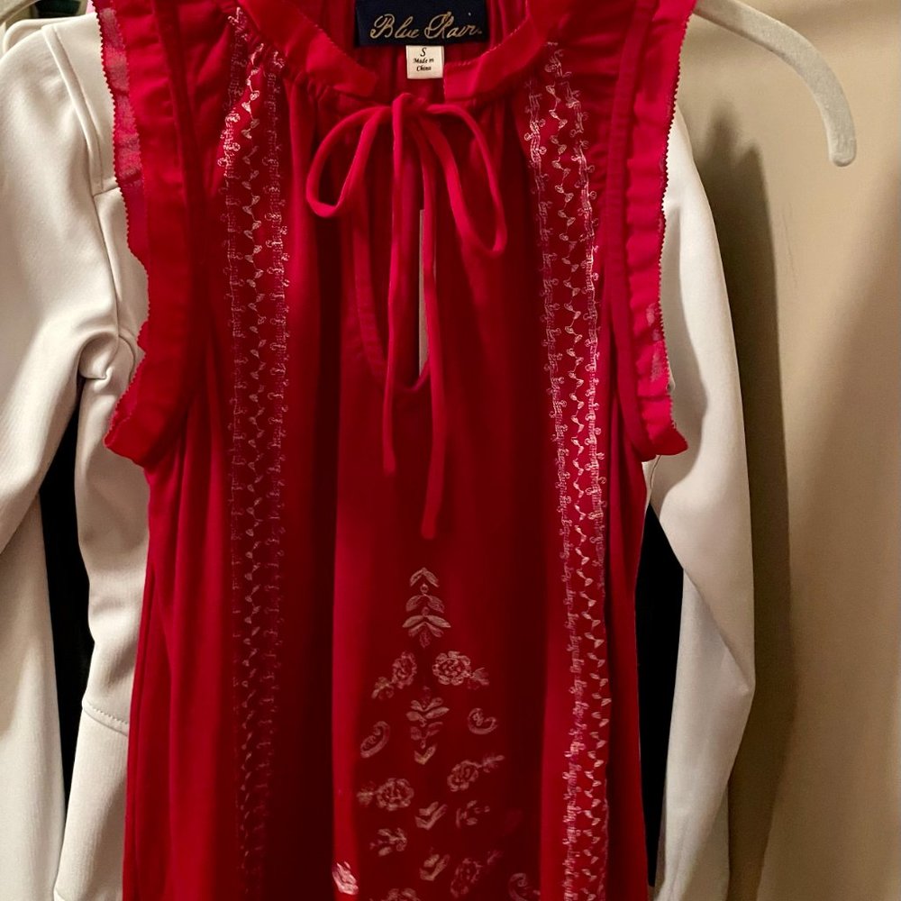 Women’s sleeveless top by Francesca’s, red with beautiful white intricate detail